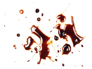 Spilled soy sauce, isolated on white background, top view