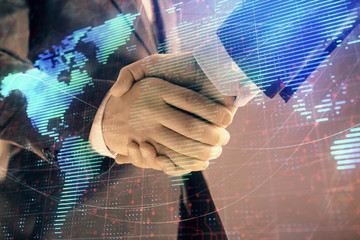 Multi exposure of world map on abstract background with two businessmen handshake. Concept of international business