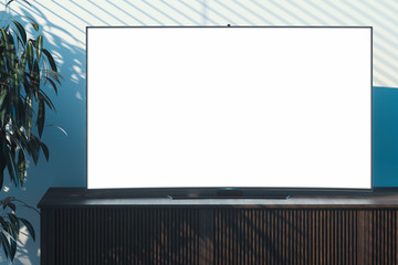 Blank big tv set with copy space on wooden cupboard in modern interior. 3d rendering.