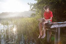 Teen Boy Sketching Summer Landscape With Pastel Sticks