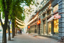Street With Garlands In The Evening, Blurred Background, Photo Without Focus