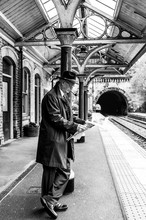 Awaiting His Train To York From Knaresborough, The Businessman Reads His Copy Of The Yorkshire Post.