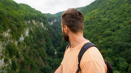 Free traveler bearded hipster man in mountains Georgia.   Travel Lifestyle concept landscape on background vacations adventure journey outdoor, human and nature.