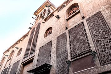 Oriental architecture with traditional Arabic patterns on the windows. Heritage Village, Deira, Dubai, Jan.2017