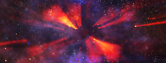 abstract glitter lights background. gold, red and purple light burst. defocused. banner