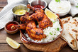 Tandoori chicken with jasmine rice and pita bread, indian cuisine.