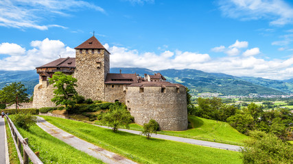Wall Mural - Vaduz castle in Liechtenstein. This Royal castle is a landmark of Liechtenstein and Switzerland. Scenic panorama of old medieval castle in Alps mountains in summer. Beautiful view of Alpine nature.