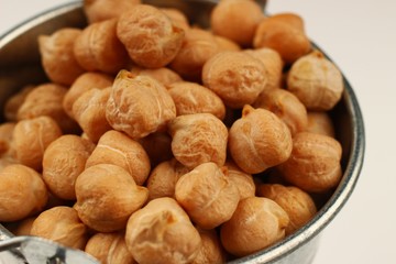 Wall Mural - chickpeas buckets on a white background closeup