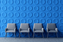 Row Of Armchairs In Blue Office Lounge