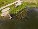 Fototapeta Pomosty - Aerial view of natural beach near lake in Kraziai
