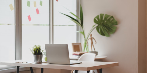 Wall Mural - minimal graphic designer workplace with open laptop computer