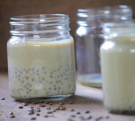 Wall Mural - black sesame soy milk in glass on wood