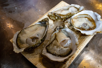  Fresh oysters at the seafood market with ice