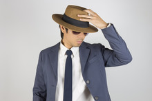 Young Asian Portrait Businessman In Navy Blue Suit Wear Sunglasses And Touch Top Of Hat