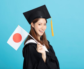 Happy asian female graduate student showing the japan flag