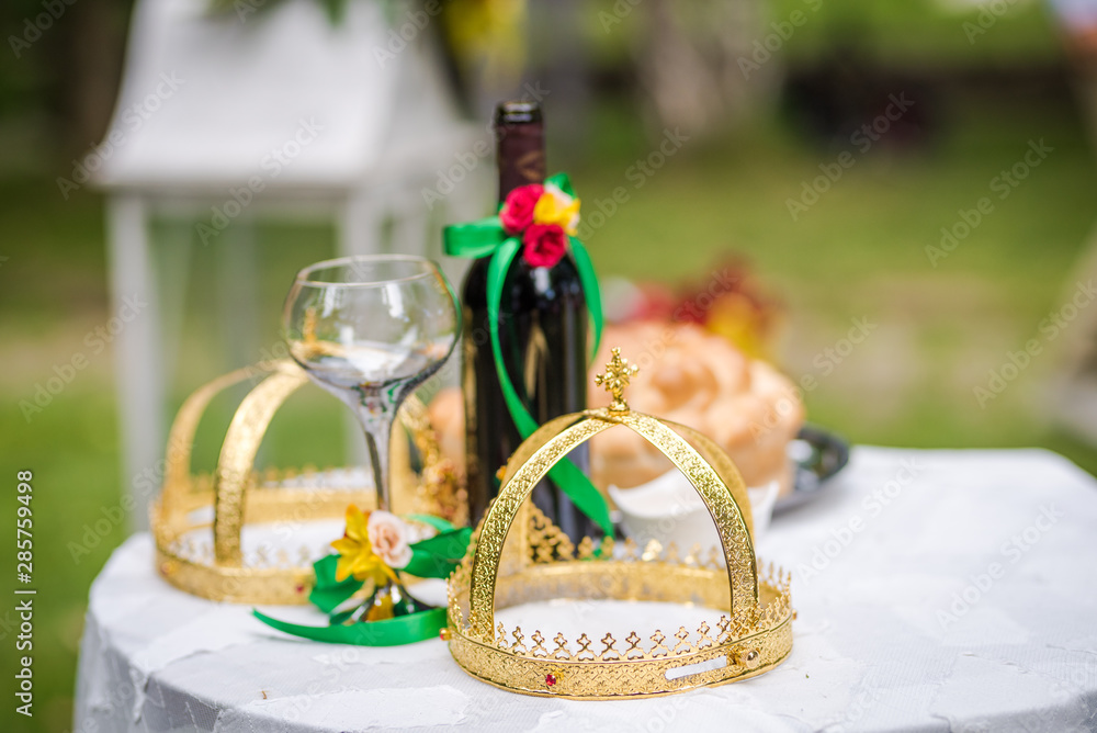 Objects for a orthodox wedding ceremony - a glass of wine , bread ...