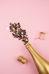 Sticker - Top view Golden bottle of champagne and confettie. Party, new year, christmas, birthday celebration