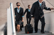 © Yakobchuk Olena - Male pilot with suitcase hurrying for flight in airport
