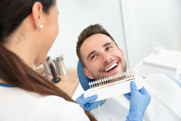 Handsome young man in stomatology clinic