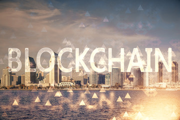 Double exposure of crypto currency theme hologram drawing and city veiw background. Concept of blockchain and bitcoin.