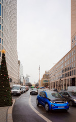 Wall Mural - Street with cars on road at Christmas market in Berlin