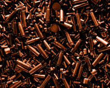 Different Size Bullet Shells On The Black Ground. War Concept. Production Of Ammunition At The Factory. Brass Bullet Shell, Ammunition Manufacturing Process