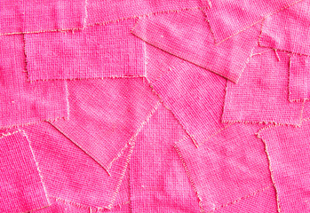 Closeup torn pieces of  pink fluorescent cloth gaffer tape texture background.