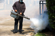 © Kitti bowornphatnon - man using smoke machine for Desinsection and pest control