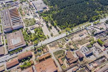 Wall Mural - drone image of industrial district at city suburbs with lots of warehouses and factory buildings