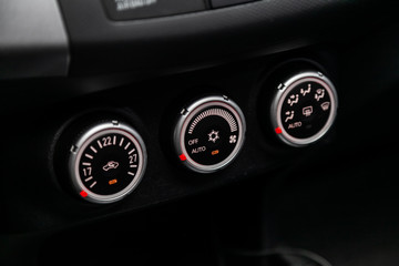 Wall Mural - Modern black car interior: climat control view with air conditioning button,.