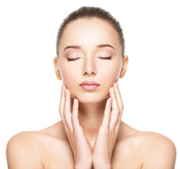 Young woman with healthy clean skin touches the face. Skin care concept.