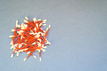 Concept for plastic pollution, environmental pollution, ecology problem. Disposable cotton buds. Flat lay, top view