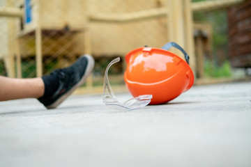 Wall Mural - fallen worker on the floor with his helmet, accident injury