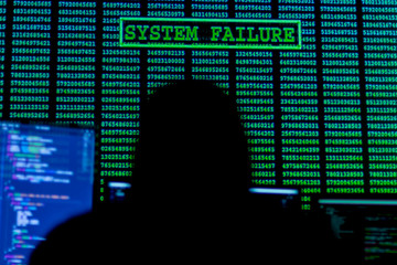 Wall Mural - back view of man in hood is hacking password. programmer is writing code on multiple screens to stea