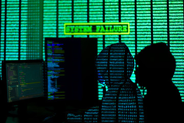 Wall Mural - man in hood and mask is hacking password. programmer is writing code on multiple screens to steal pr