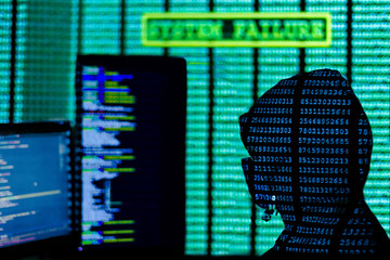 Wall Mural - man in hood and mask is hacking password. programmer is writing code on multiple screens to steal pr