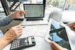 © snowing12 - Real-estate concept, Two engineer and architect discussing blueprints data working and digital tablet on construction building project.