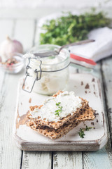 Sticker - Crispbread toast with homemade herb and garlic cottage cheese on wooden background