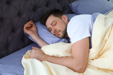 Canvas Print - Handsome man sleeping on pillow at home. Bedtime