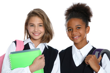 Happy girls in school uniform on white background