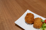 Fototapeta Góry - Japanese Crunchy Fried, Hokkaido Pumpkin Croquette on plate in restaurant.
