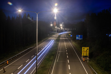 Wall Mural - Kouvola, Finland - 24 August 2019: Long exposure photo. Night road in Kouvola, Finland