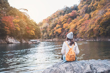 Young Woman Traveler Looking Beautiful Landscape At Arashiyama Japan, Travel Lifestyle Concept
