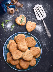 cheese cookies recipe photo of empty food background with vintage spatula and rosemary, on slate stone surface