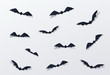 Halloween bat vector decor background. Paper cut style. Black vampire flittermouse flying over white backdrop