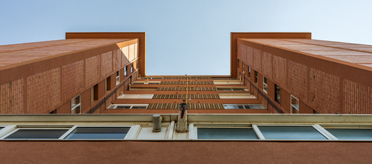 Wall Mural - Tall building seen from below