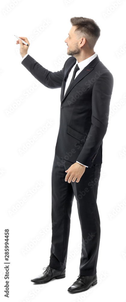 Handsome male teacher writing something against white background