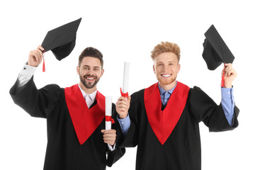 Sticker - Young students in bachelor robes on white background