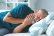 © Pixel-Shot - Senior man suffering from toothache at home