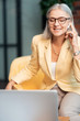 Successful businesswoman taking part in an online conversation